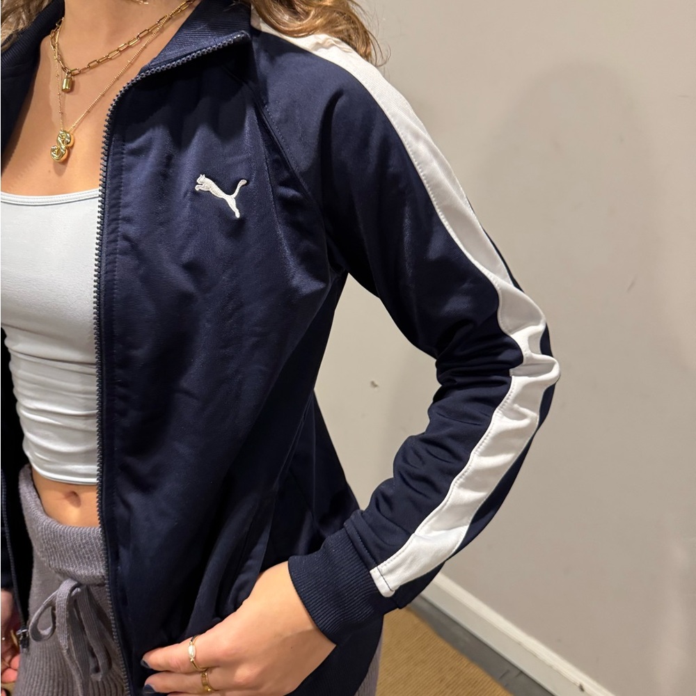 puma blue zip up. size boys medium. lightly worn. white strip on side.